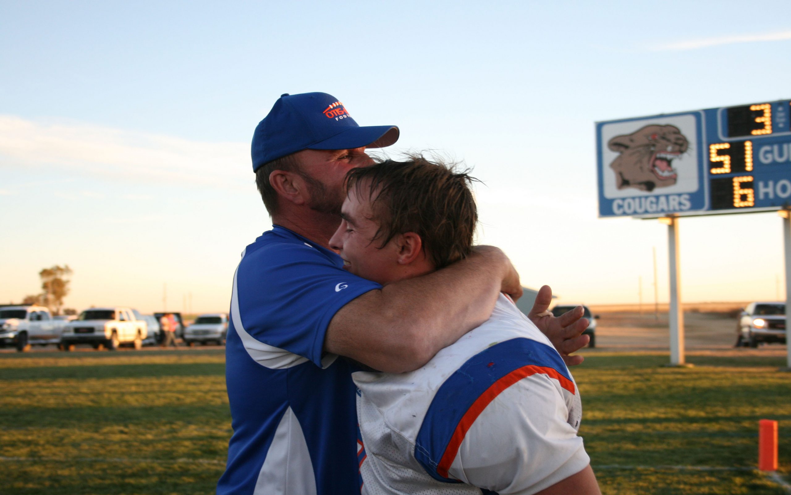 A Father Hugs His Son
